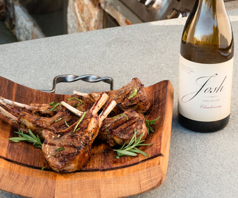 Picture of Lamb Chops next to a bottle of Josh wines